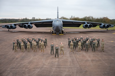 Operations Airmen from the 20th Expeditionary Bomb Squadron stand together in front of a B-52H Stratofortress during Bomber Task Force 25-1 Dec. 4, 2024, at RAF Fairford, England. BTF missions familiarize aircrew with air bases and operations in different geographic combatant command areas of operations to enable strategic access and integration with coalition forces in an effort to deter global conflict. (U.S. Air Force photo by Senior Airman Mary Bowers)