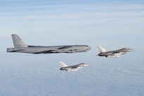 A U.S. Air Force B-52H Stratofortress assigned to the 20th Expeditionary Bomb Squadron is escorted by two Royal Danish Air Force F-16 Fighting Falcons above the Baltic Sea during Bomber Task Force 25-1, Nov. 15, 2024. We are stronger together. BTF 25-1 is a part of a long-term multinational training plan to maintain readiness and interoperability between NATO Allies and partner nations in the Baltic Sea region. (U.S. Air Force photo by Senior Airman Jacob Cabanero)