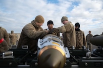 U.S. Airmen assigned to the 20th Expeditionary Bomb Squadron assemble GBU-38 Joint Direct Attack Munitions during Bomber Task Force 25-1 at RAF Fairford, England, Nov. 12, 2024. The operational readiness of U.S. Forces across all domains is critical to building partnerships, responding to crisis, providing deterrence, and supporting our Allies and partners. (U.S. Air Force photo by Senior Airman Jacob Cabanero)