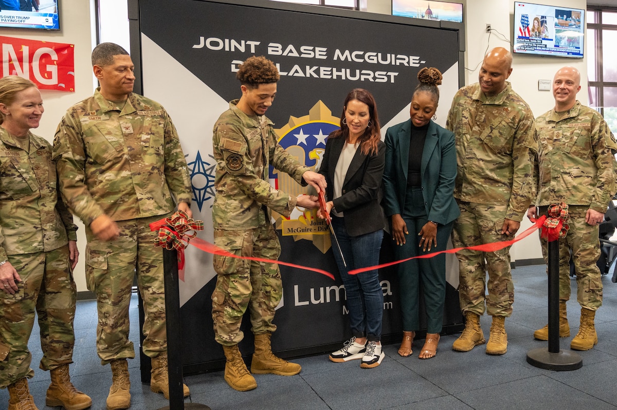 Joint base leaders join U.S. Air Force Airman Trentist Johnson, 87th Force Support Squadron food service journeyman, Dr. Janell MacAulay, mindful leadership speaker, and Nicole Moss, Intervention, Prevention and Resilience Office chief, in a MindGym ribbon cutting ceremony at Joint Base McGuire-Dix-Lakehurst, N.J., Dec. 11, 2024. The MindGym, located in the McGuire Fitness Center, is designed to help service members strengthen their mental fitness and marks a significant milestone in the joint base’s efforts to address the holistic wellness of its personnel. (U.S. Air Force photo by Susan Moriarty)