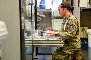 Service member works with pharmaceuticals.