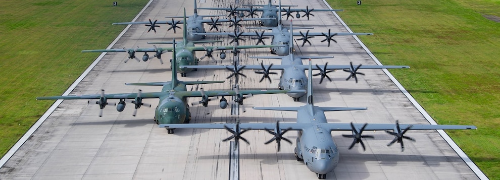 A multinational formation of C-130J Super Hercules and C-130H Hercules aircraft from the U.S. Air Force, Japan Air Self Defense Force, Republic of Korea Air Force, Royal Canadian Air Force, and Royal Australian Air Force taxi into position during an "elephant walk" on Andersen Air Force Base, Guam, Dec. 14, 2024, in support of Operation Christmas Drop 2024.