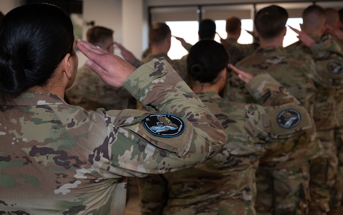 Guardians assigned to the 33rd Range Squadron render the first salute to the new commander, U.S. Space Force Lt. Col. Brandon Wilson, during an assumption of command ceremony at Schriever Space Force Base, Colorado, December 16, 2024.