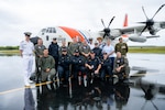 Members of an HC-130 Hercules airplane crew from Coast Guard Air Station Barbers Point and Coast Guard Fourteenth District staff pose for a photo with members of the Royal New Zealand Navy at Hanan Niue International Airport in Alofi, Niue, Oct. 19, 2024. The U.S., New Zealand, Australia, the Cook Islands, Fiji, France and Japan were among the countries represented at Niue’s 50th Constitution Day celebration. (U.S. Coast Guard photo, courtesy U.S. Embassy New Zealand)