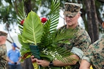 U.S. Marine Corps Maj. Gen. Daniel Shipley, deputy commander, U.S. Marine Corps Forces, Pacific, presents a wreath to the 1st Marine Division memorial during the 80th Commemoration of the Battle of Peleliu in Peleliu State, Republic of Palau, Sept. 15, 2024. The exceptional heroism and sacrifices made by Marines and Soldiers at the battle of Peleliu during World War II underscore the United States’ commitment to a free and open Indo-Pacific and inspire us to continue to enhance our strong partnerships in this vital region. (U.S. Marine Corps photo by Lance Cpl. Blake Gonter)