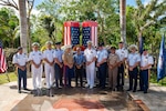 240920-N-ML137-1161 TAMUNING, Guam (Sept. 20, 2024) - U.S. Navy Rear Adm. Brent DeVore, commander, Joint Region Marianas, center right, retired U.S. Army Lt. Col. David S. Okada, center left, and other military leaders on Guam attend a 9/11 remembrance ceremony at Two Lovers Point, Sept. 20. Due to Tropical Storm Bebinca during the week marking the 23rd anniversary of this tragedy, the ceremony was postponed for safety reasons and instead took place the following week, coinciding with the day former President George W. Bush declared the 