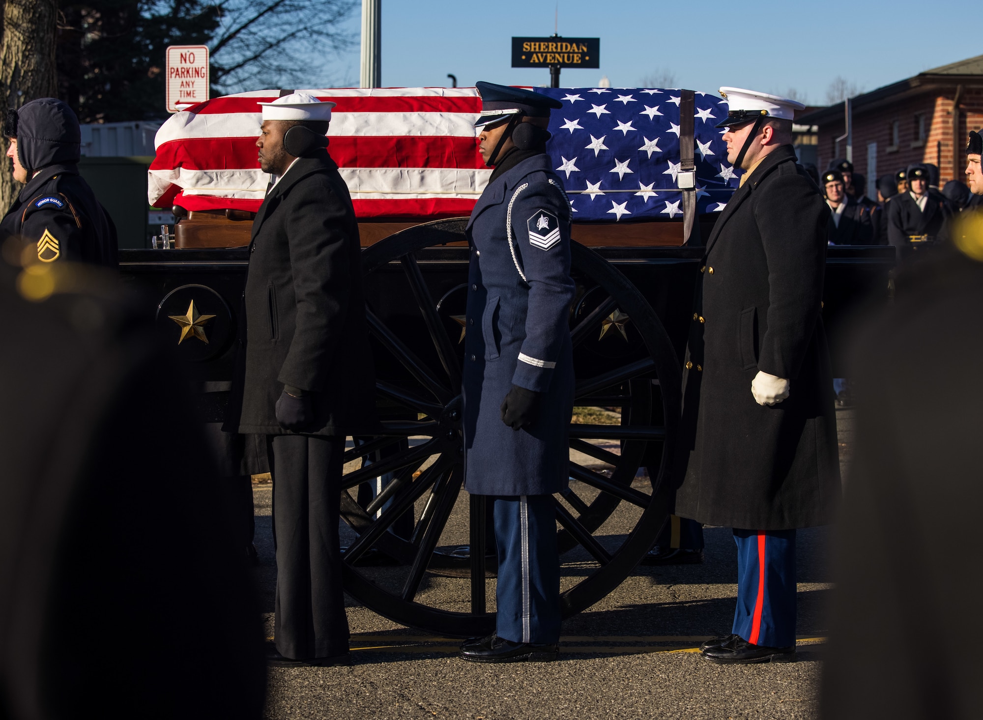 Service members in state funeral procession.