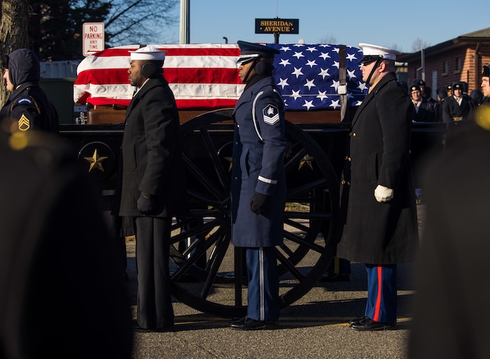 Service members in state funeral procession.