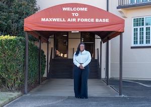 Contina Harmon, 42nd Operations Support Squadron airfield management specialist, poses for a photo on the flight line at Maxwell Air Force Base, Alabama, Jan. 2, 2025.