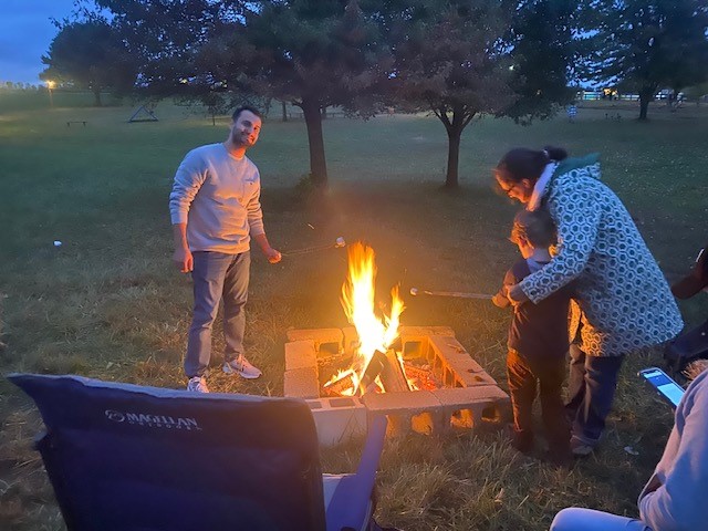 Roasting Marshmallows – Fellowship Retreat Fall 2023