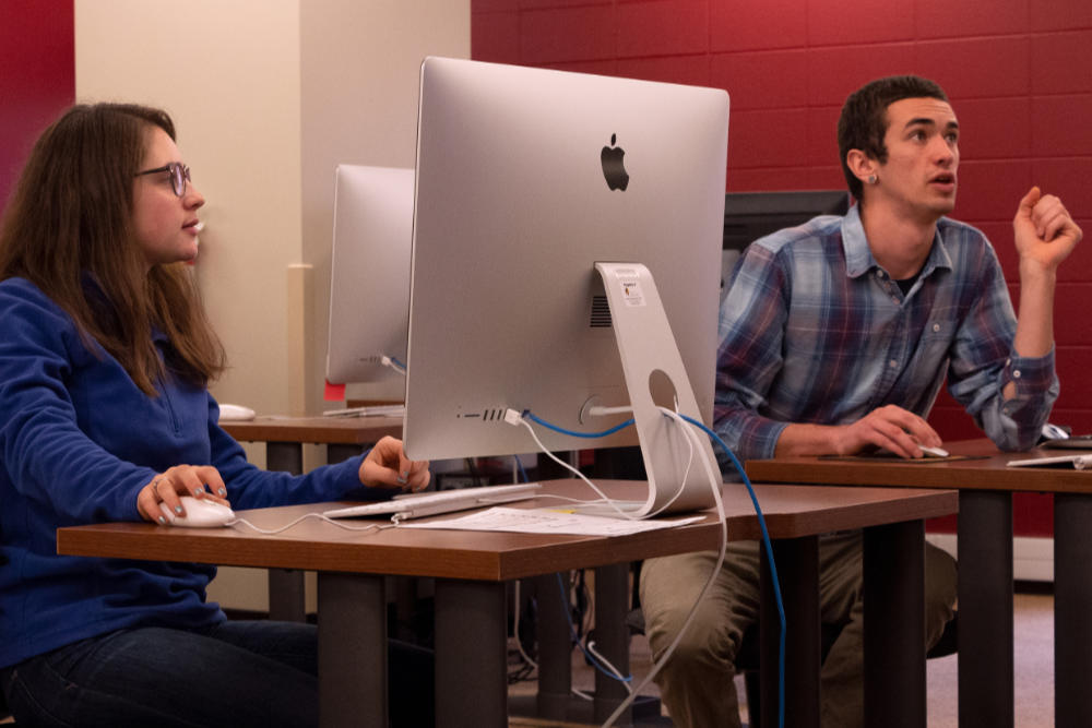 photograph two students working on computers