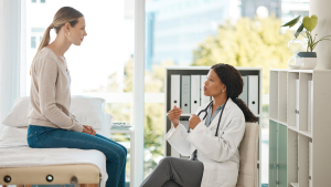 Doctor appointment, consulting and talking to patient discussing test results and process, procedure or treatment plan. Gynecologist, medical healthcare worker or GP explaining checkup at hospital