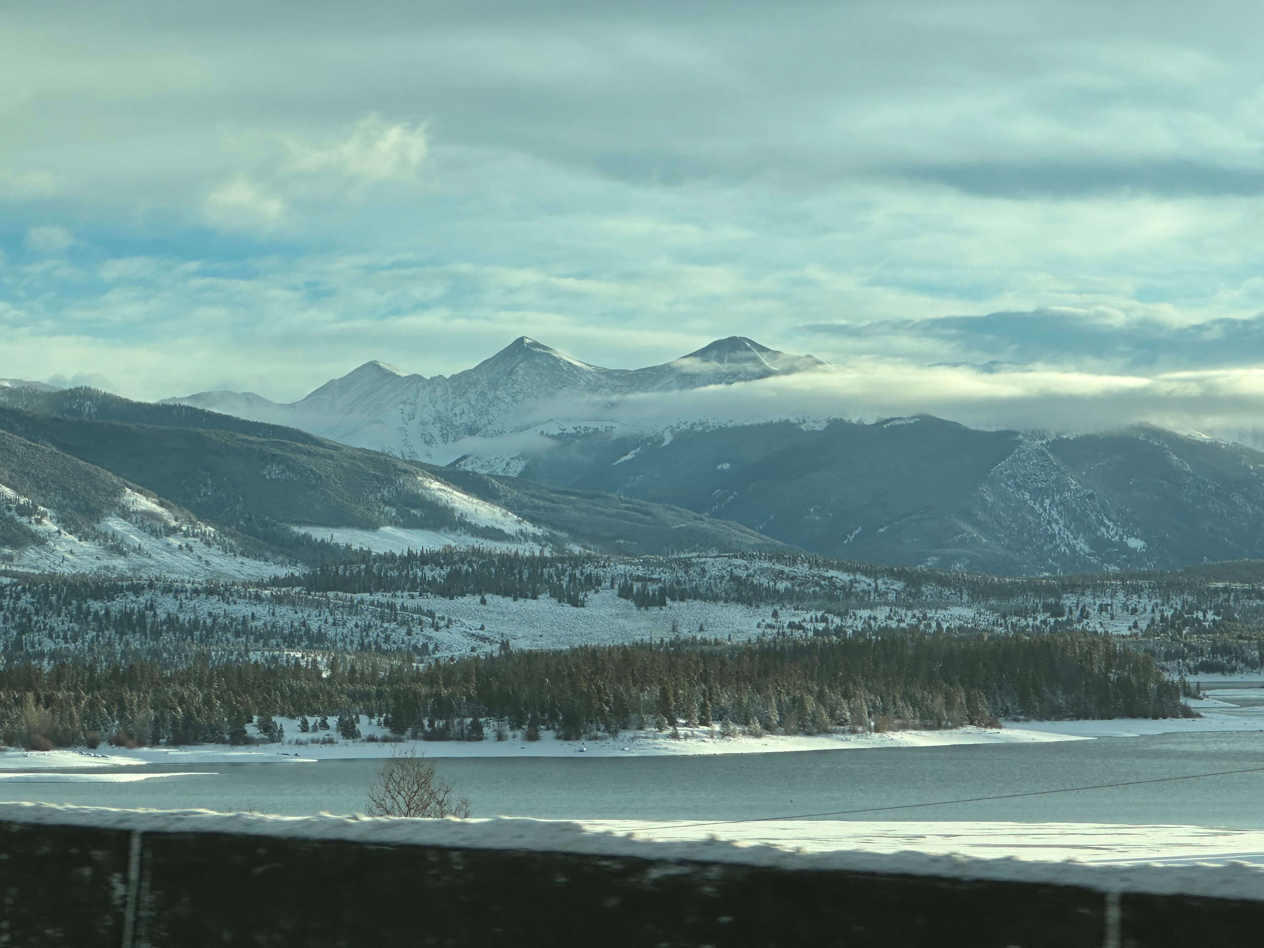 Snowy landscape with water photo taken from road