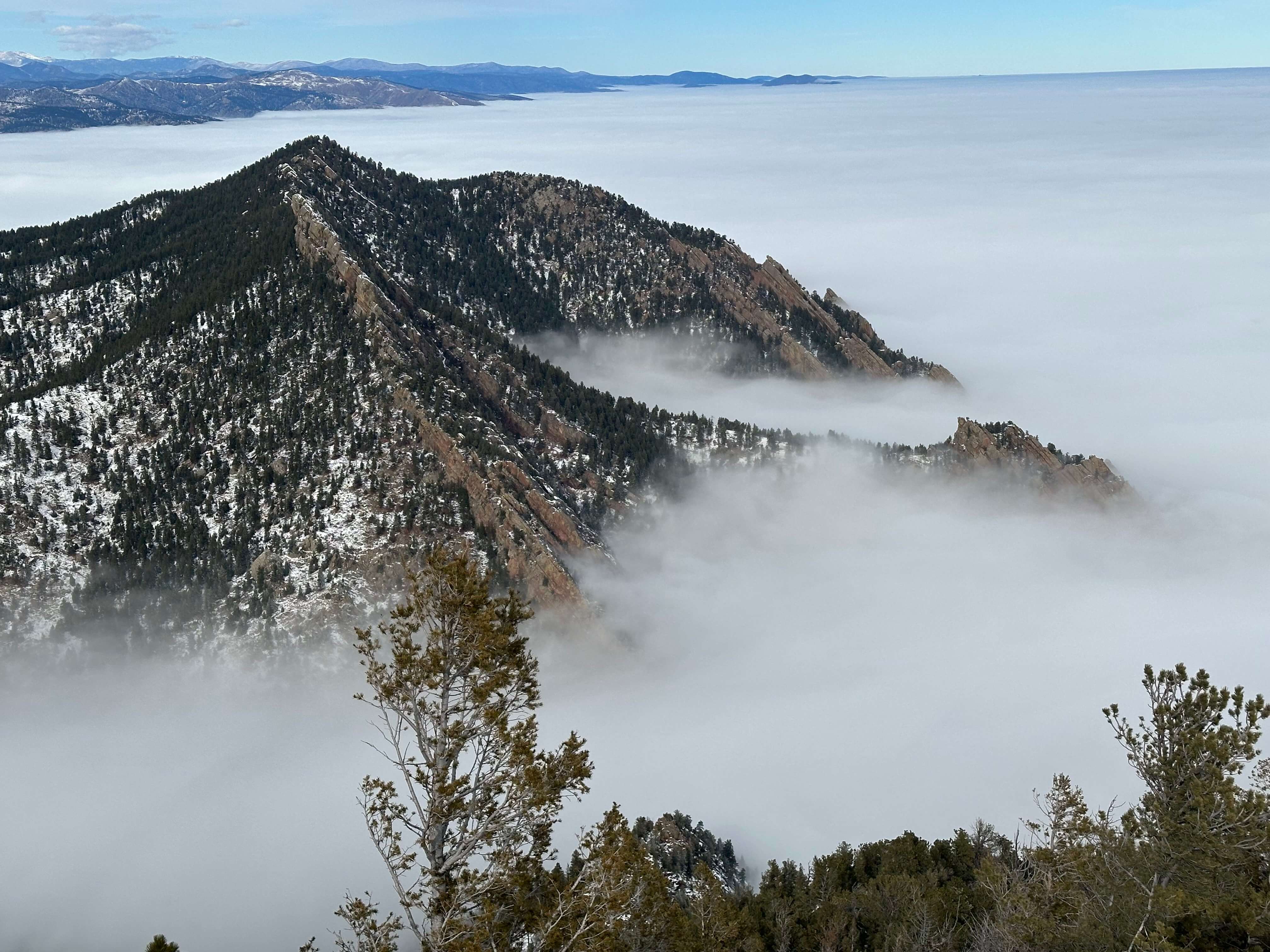 Mountain with fog surrounding it