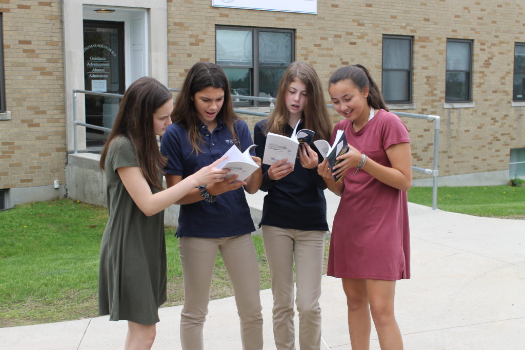 Students Viewing Their Published Artwork in 2018