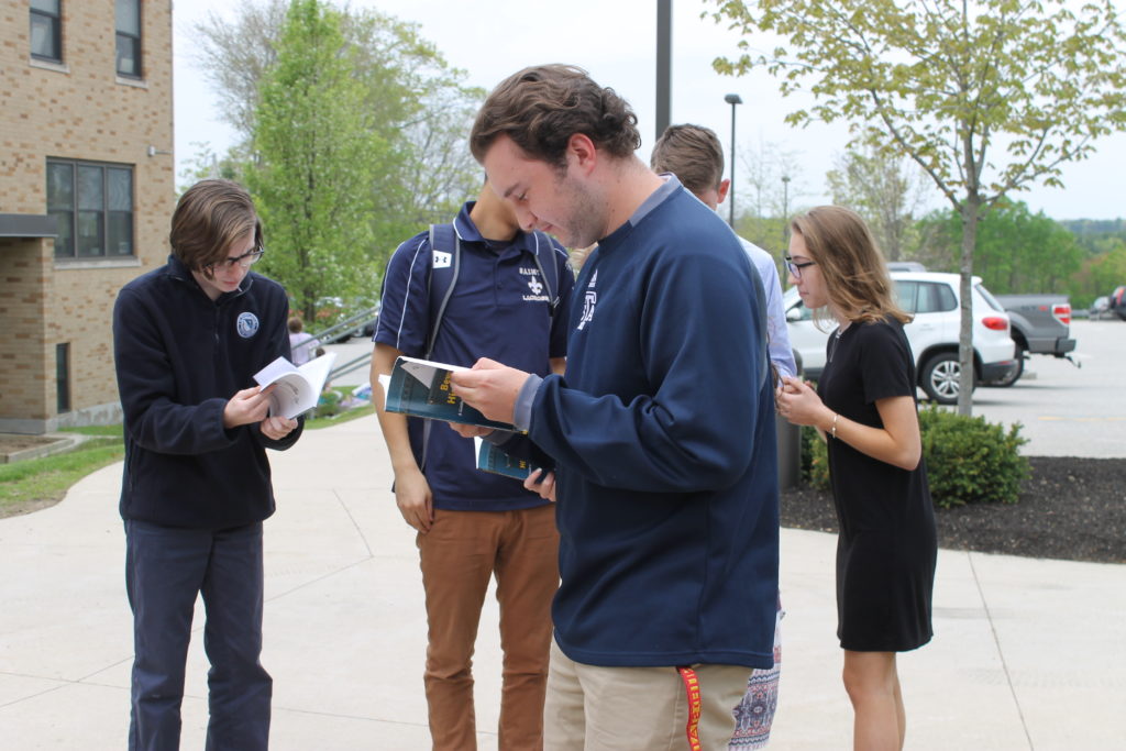 Students Viewing Their Published Artwork in 2018