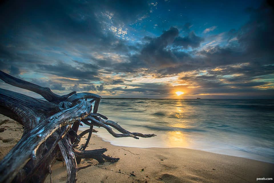 a view of the ocean at sunset