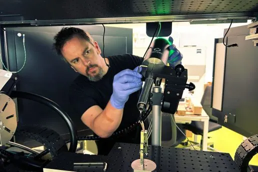 Charlie Wood from Portsmouth University positions a wide-nozzle Cryostream for micro-CT analysis.