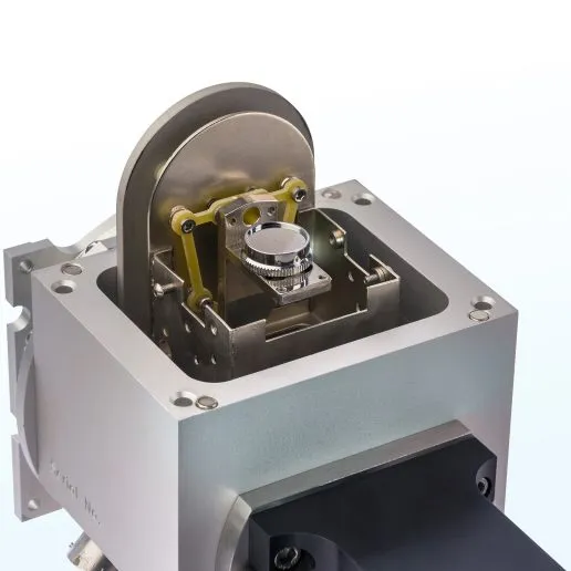 A Phenix cryostat with its lid removed, exposing the recessed flat-plate sample holder inside.