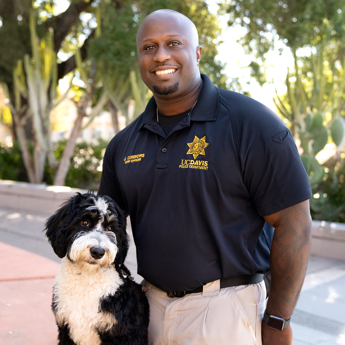 Headshot of CORE Officer Joe Connors with K9 Leia.