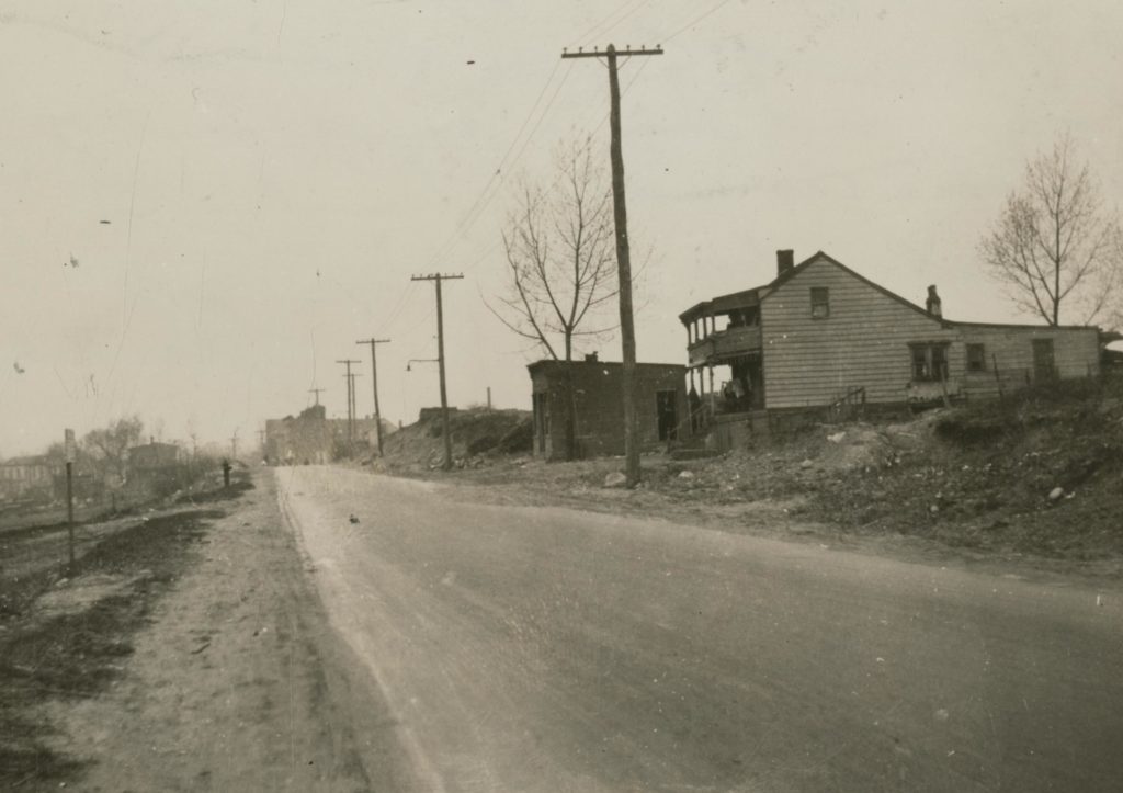 This April 1923 photo shows Cooper Avenue looking west from what is today 80th Street. (photo via Queens Library digital archives)