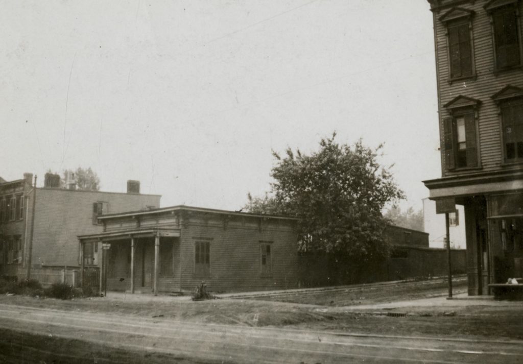 This 1922 photo shows the southwest corner of Fresh Pond Road and Bleecker Street (photo via Queens Library Digital Archives)