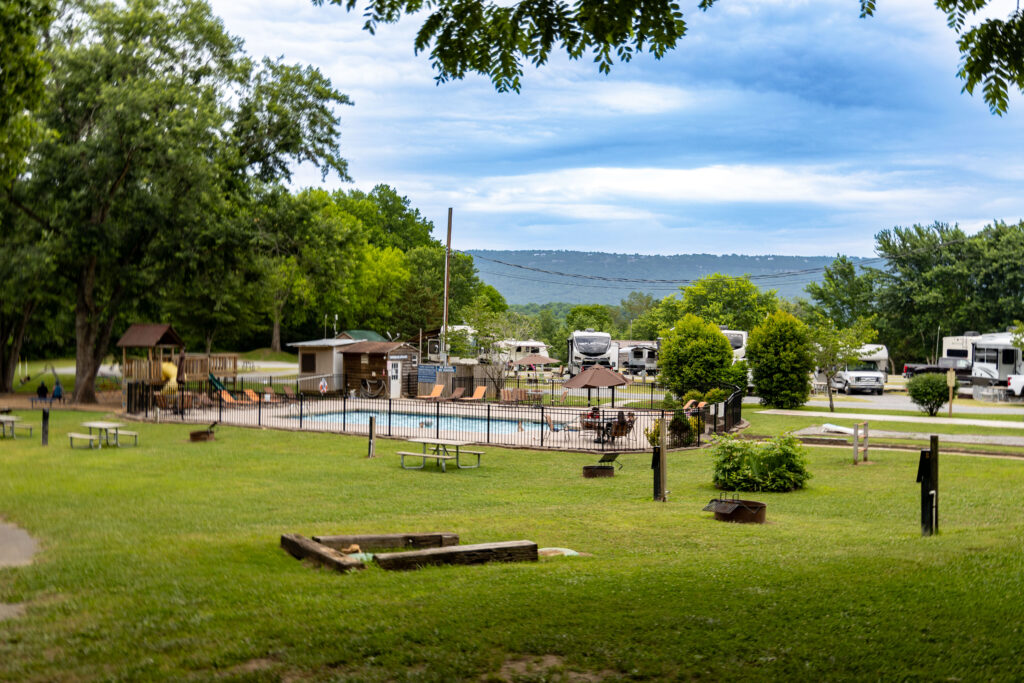 Raccoon Mountain Campground game area with pool and horseshoes