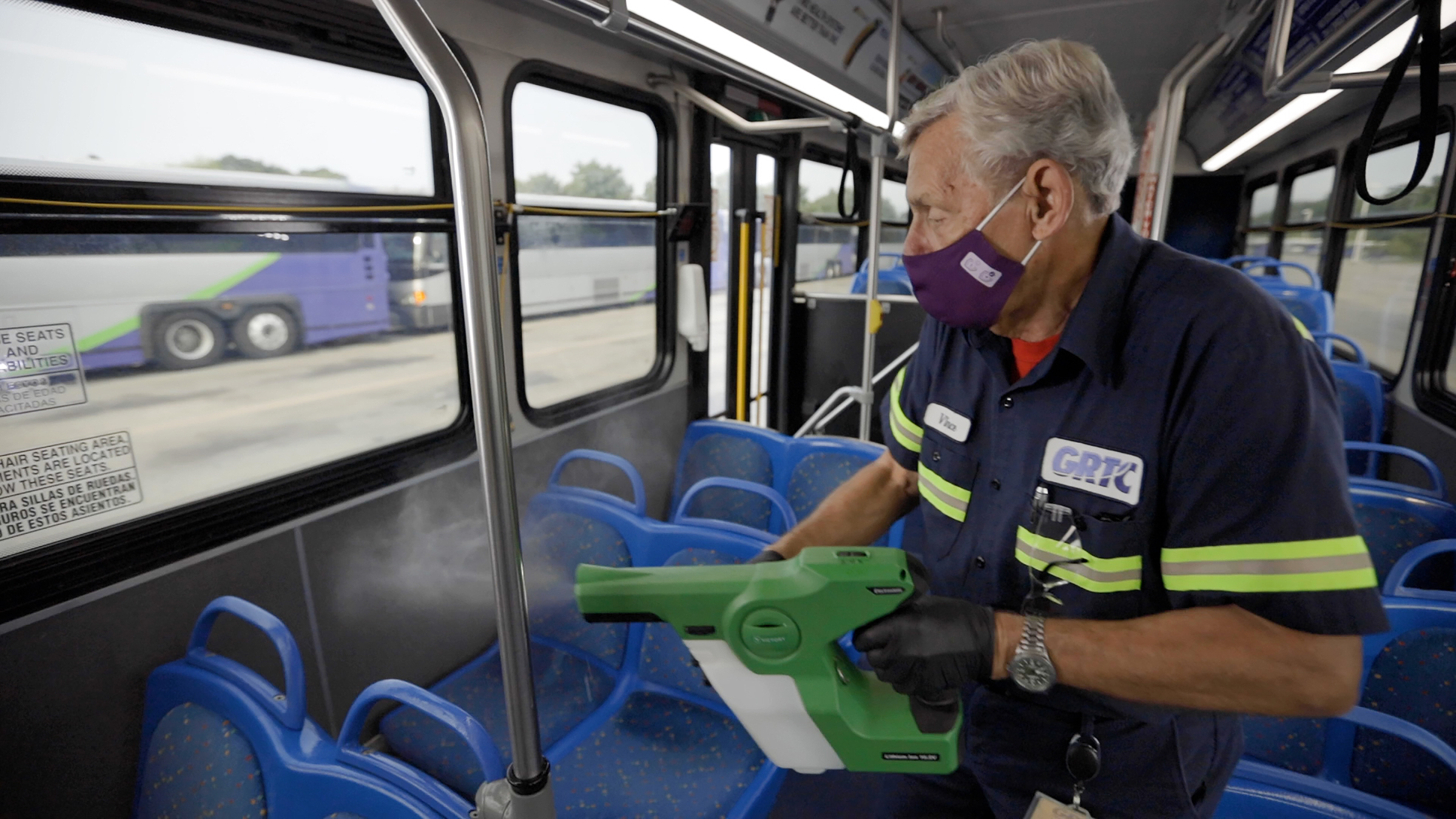 Bus lot with cleaner 