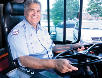 GRTC bus operator smiling on bus