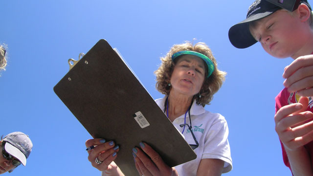 photo of a woman teaching about the ocean