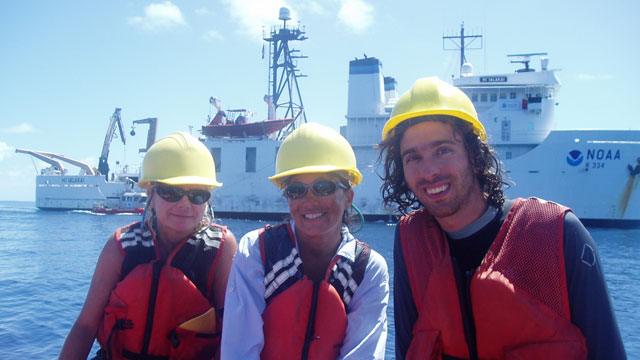 students and teacher at the sea