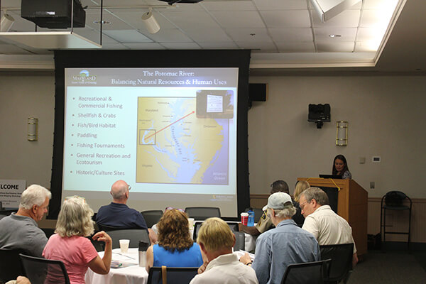 A woman gives a presentation at a meeting