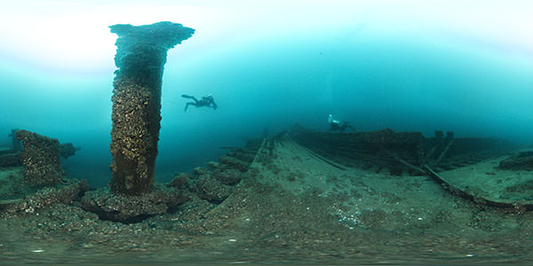 two diver swimming over the deck of the jl shaw