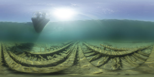 a dive boat idles over the shallow remains of sidewheel steamer New Orleans