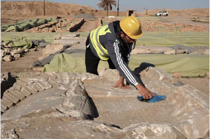 Archaeologists have been carefully reassembling bas-reliefs, sculptures and decorated slabs from an ancient Assyrian palace