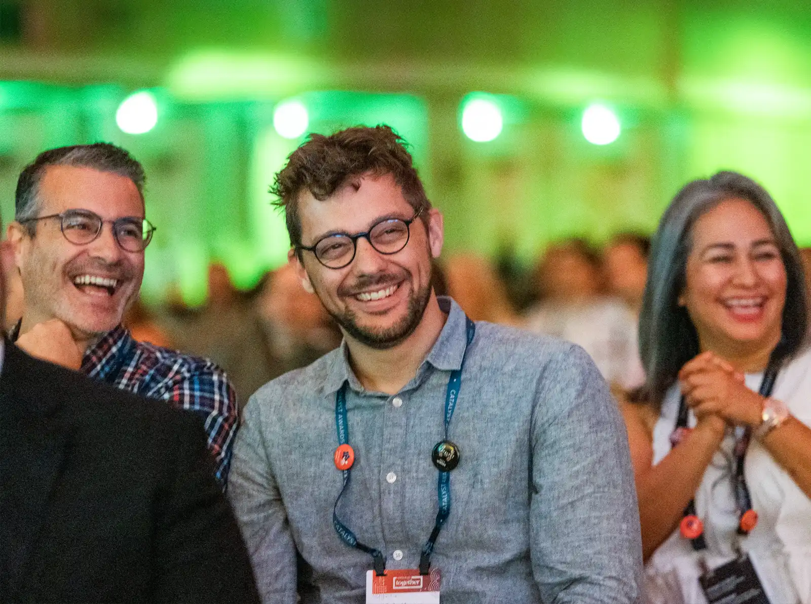 Photo of attendees at AT23 with the focus on three people in the front of the view