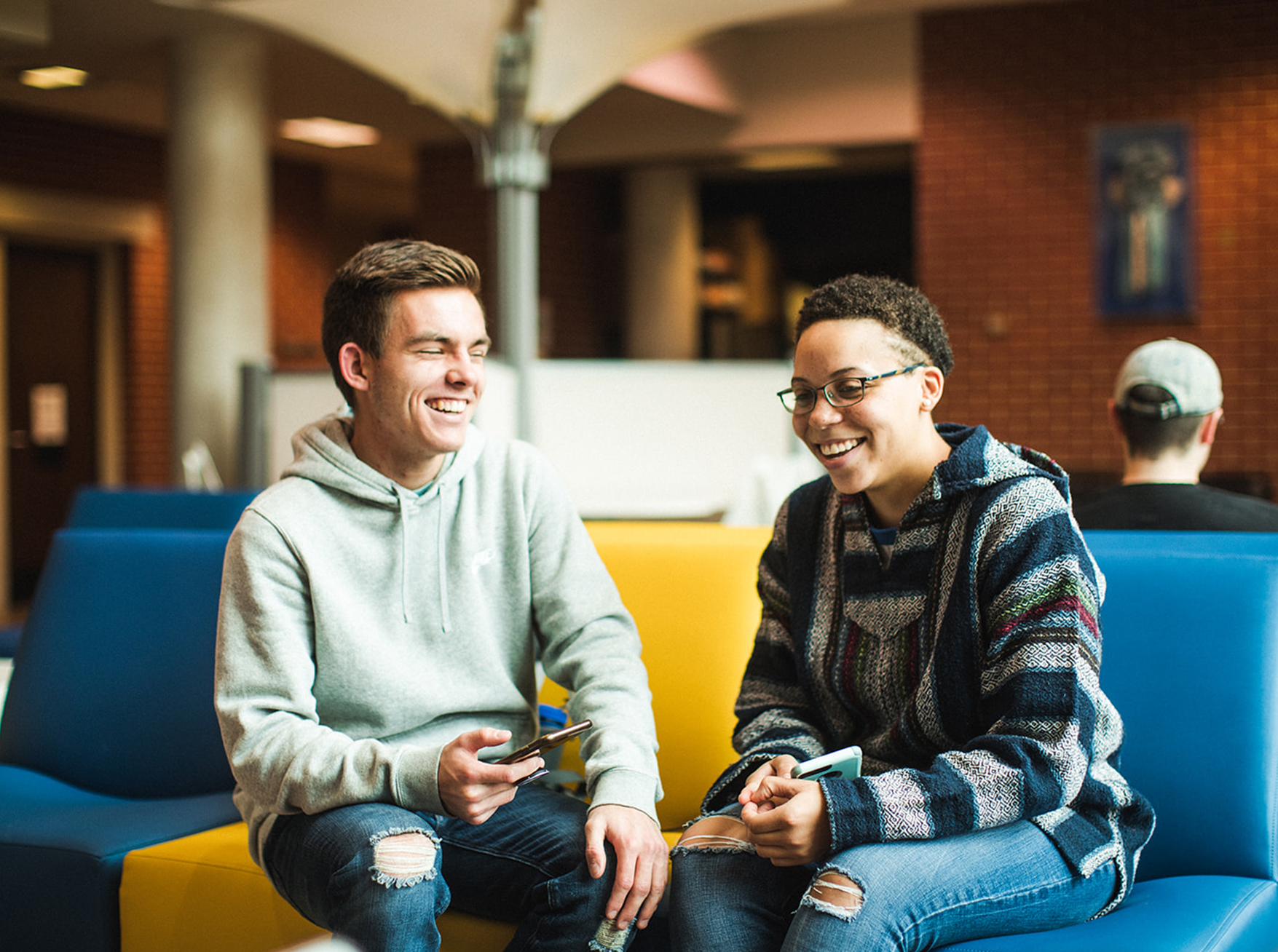 Students sitting in the lobby of the Egan Leadership Center