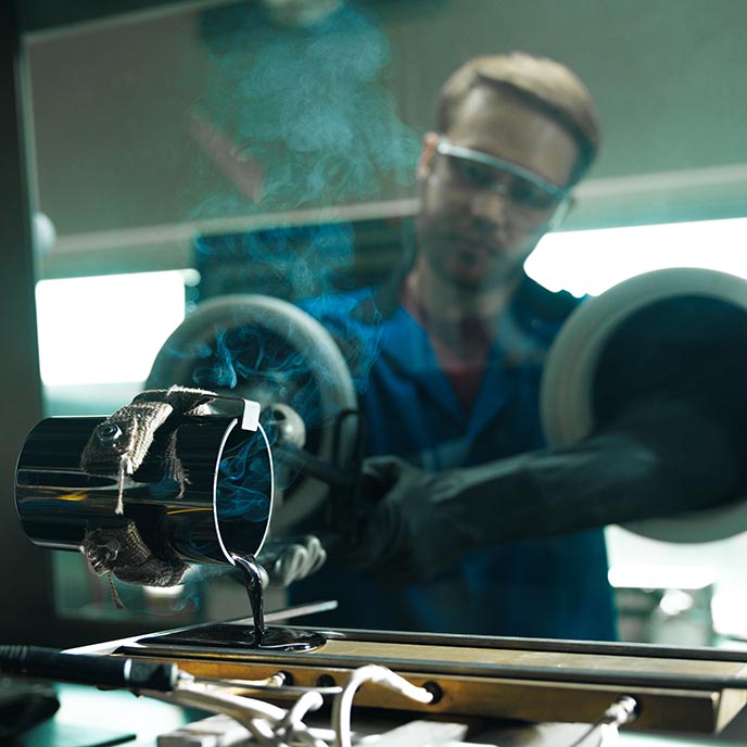 A researcher works on lab equipment.