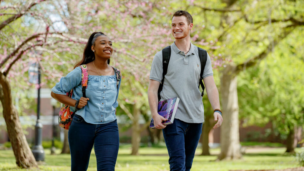 UTM students walking on campus and heading to class.