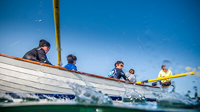 people rowing a boat