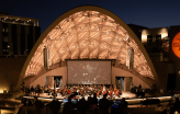 Slideshow: Epstein Family Amphitheater with musicians performing on stage.