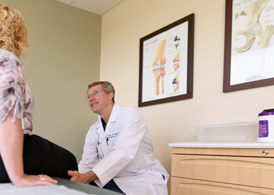 Dr. Selby examines a patient.