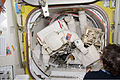 Dave Wolf (foreground) and Tim Kopra (feet and legs visible in background) are suited and ready for the first of five spacewalks