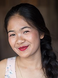 Portrait of a smiling 15 year-old Laotian teen