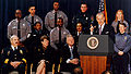 Joe Biden (D-Delaware) speaks at the signing of the 1994 Biden Crime Bill as Attorney General Janet Reno, President Bill Clinton, and local law enforcement officials look on.