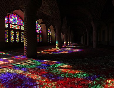 A view of the interior of Nasir ol Molk Mosque located in Shiraz. The mosque includes extensive colored glass in its facade that make beautiful colors when light is passed through them and is reflected on the carpets. Photograph: Ayyoubsabawiki Licensing: CC-BY-SA-4.0