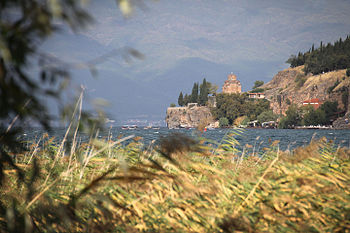 View of the Church of St. John at Kaneo, Ohrid, across the lake shore of Lake Ohrid. Photograph: Branka Vučiḱeviḱ-Vučkoviḱ Licensing: CC-BY-SA-4.0