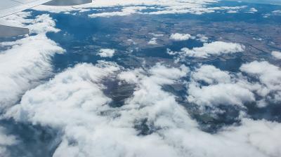 flying above the clouds watching the landscape