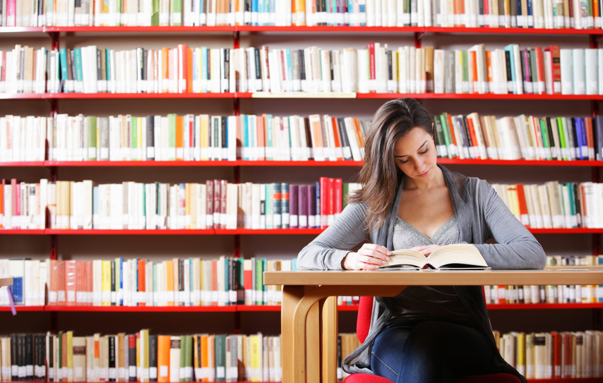 Portrait of a student  girl studying at library