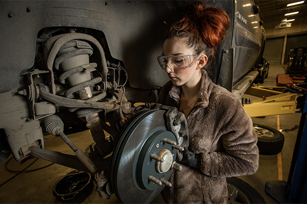 Female automotive mechanic student